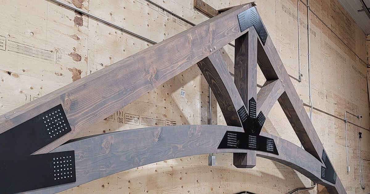 Decorative timber truss with black steel connector plates